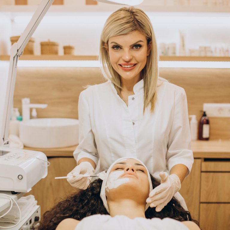 Woman visiting cosmetologist and making rejuvenation procedures